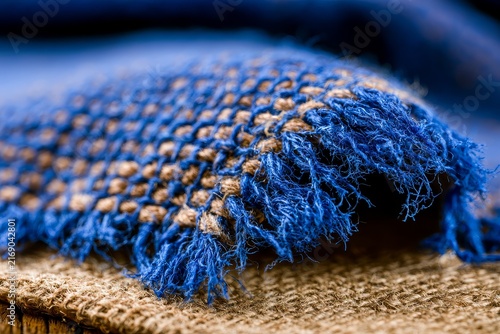 Handwoven artisan object, from the side with artisan detail and warm color