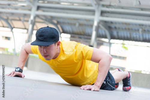 Asian man exercise in the gym. Healthy and Lifestyle Concept.