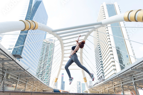 Asian young beautiful slim woman wearing sport cloths fly or jump into the sky, diet weight loss and moving for high jumping concept