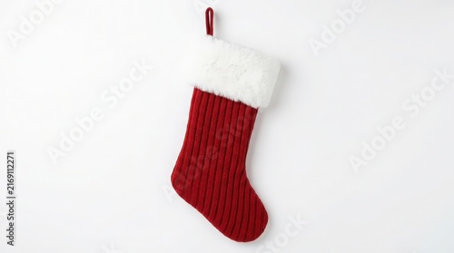 Vibrant Red Knitted Christmas Stocking with White Fur Cuff on White Background