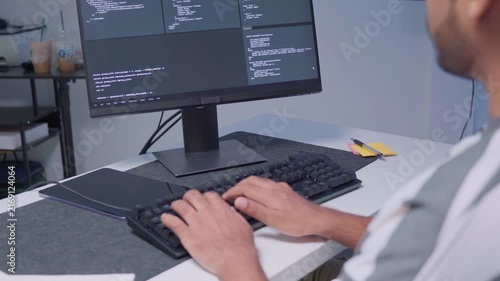 Software engineer wearing casual clothing typing on keyboard desktop computer information AI, management cybersecurity or coding software development. Programmer adult working artificial intelligence