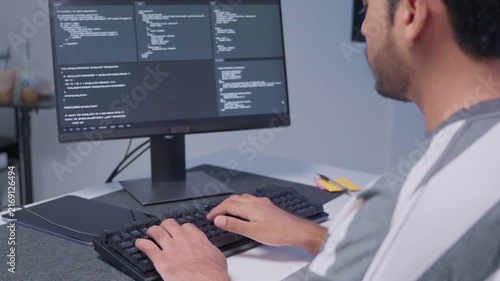 Software engineer wearing casual clothing typing on keyboard desktop computer information AI, management cybersecurity or coding software development. Programmer adult working artificial intelligence
