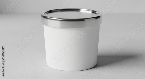 Empty white plastic container with metal lid on gray background.
