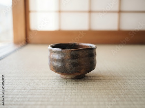 Traditional Japanese Tea Bowl on Tatami Mat.