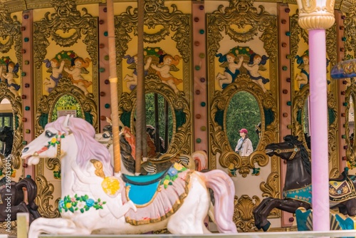 Photography Reflection of a traveler captured in a carousel mirror, Gucun Park, Shanghai