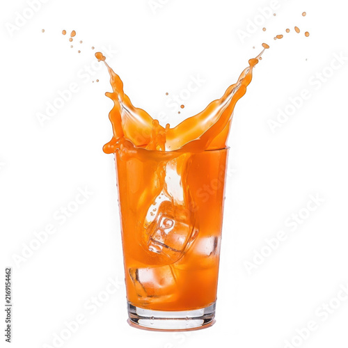 Fresh orange juice splashing into glass with vibrant citrus motion and energy