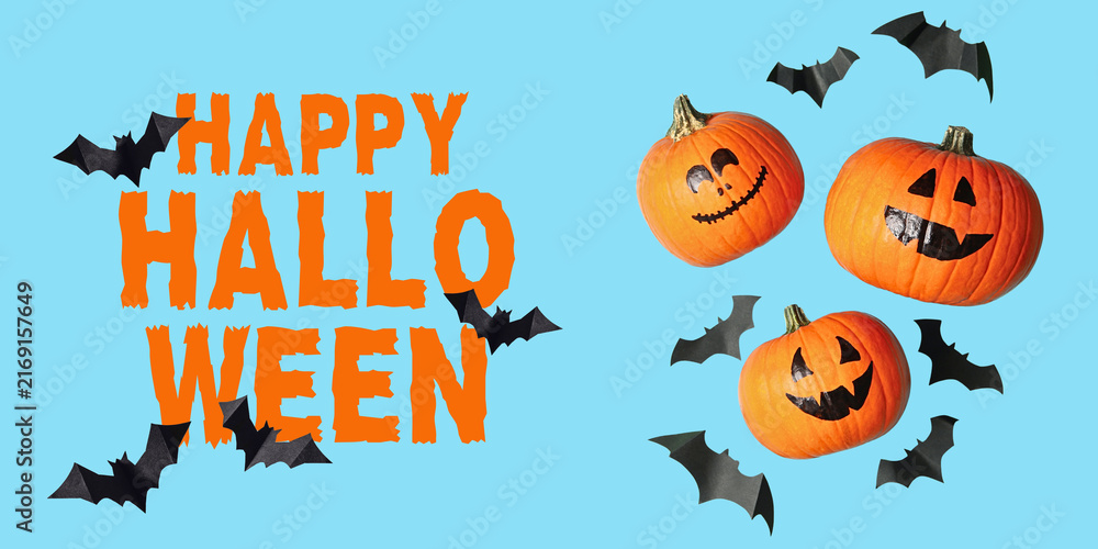 Naklejka premium Halloween. Bright pumpkins with spooky faces juxtaposed against playful bats