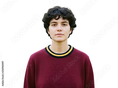 A young person with curly dark hair wearing a maroon sweater isolated portrait