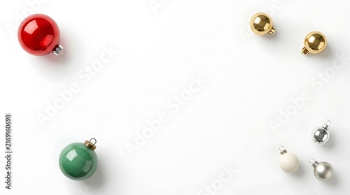 Festive christmas ornaments in red green gold and silver colors arranged on a clean white background surface