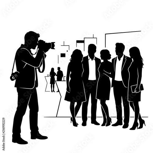 Photographer takes a group photo of dressed-up guests at an evening event or party.