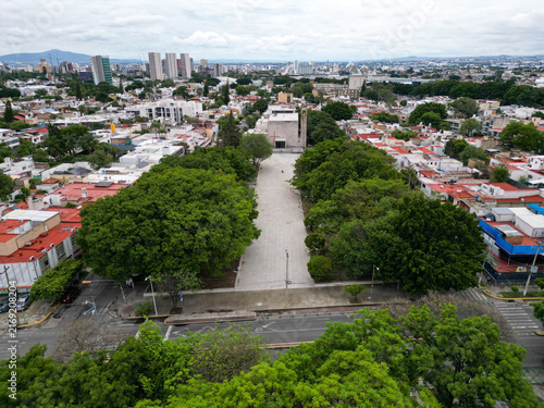 Aerial photo of Guatemala park and El Calvario parish surrounded by trees and buildings in Guadalajara