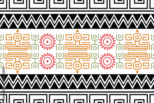 Illustration seamless geometric pattern featuring ethnic Aztec, Mayan, or tribal-inspired motifs in red, orange, and green on a white background.