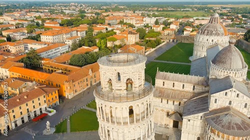 Pisa, Italy. Famous Leaning Tower and Pisa Cathedral in Piazza dei Miracoli. Summer. Morning hours. Drone footage, Departure of the camera