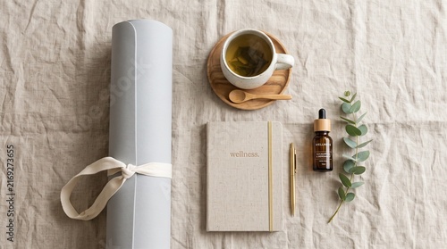 Wellness Flatlay With Notebook, Tea, Essential Oil and Rolled Yoga Mat for Self-Care Rituals