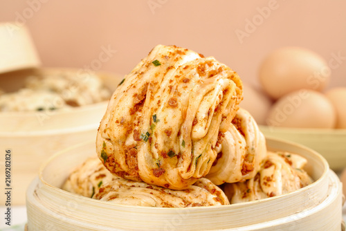 Картината върху платно Spicy Scallion Buns Steamed Rolls in Bamboo Basket Asian Dim Sum Food Photograph