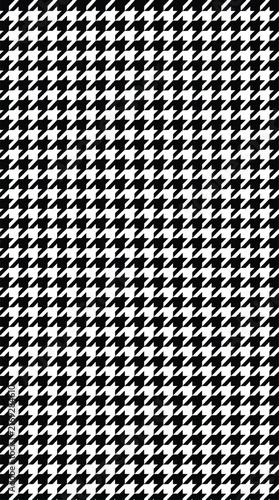Houndstooth pattern monochrome gray textile fabric background.