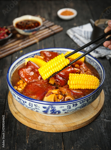 Bild auf Leinwand Braised Pork Trotters with Corn and Soybean - Traditional Chinese Comfort Food i