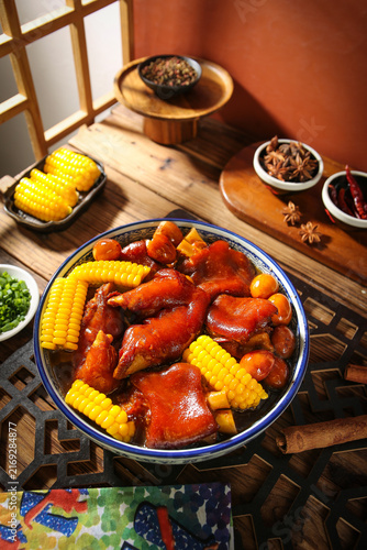 Braised Pork Trotters with Corn in Spicy Sauce - Traditional Asian Cuisine Dish