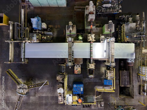 Overhead view of industrial factory floor with machinery and worker
