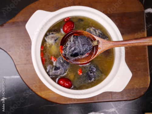 Fotografie Black Chicken Herbal Soup with Goji Berries Traditional Chinese Medicine Food in