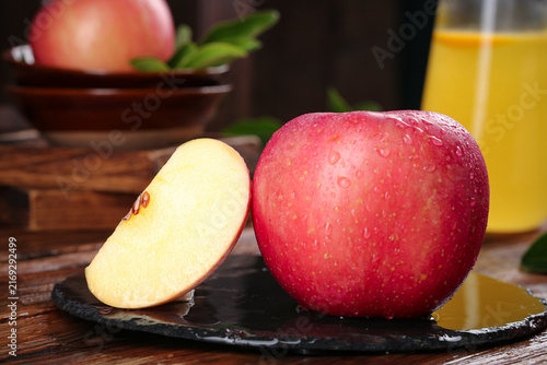 Canvas Print Fresh Cut Red Apple with Water Droplets on Slate Board - Healthy Fruit Photograp