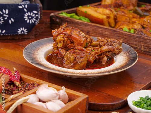 Fotografie Braised Pork Knuckle in Savory Glaze with Garlic and Spices Traditional Comfort