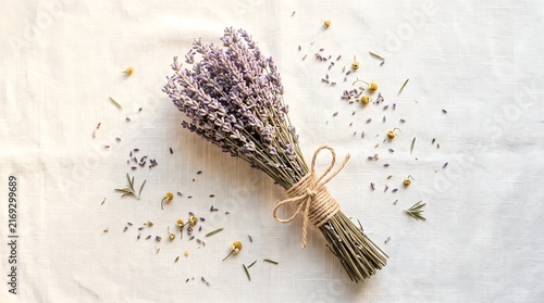 Dried lavender bundle tied twine white fabric flat lay