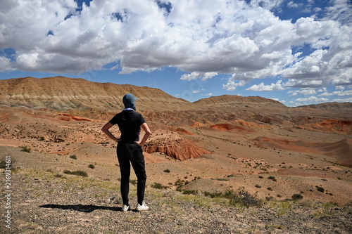 Rear view of mature woman standing and watching the view in Gobi Desert, Mongolia