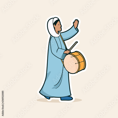 Man playing a drum to wake people for Suhoor during Ramadan