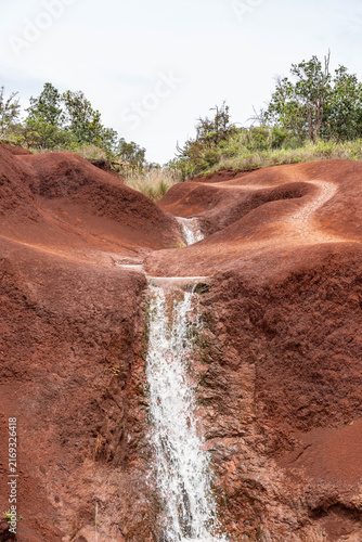 Red Dirt Waterfall. Spheroidal weathering basalt, Waimea Canyon Basalt / Napali Member / Lava flows. Waimea Canyon Drive, Kauai County, Hawaii. Red soil.