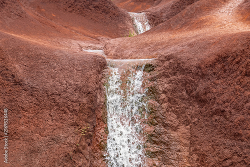 Red Dirt Waterfall. Spheroidal weathering basalt, Waimea Canyon Basalt / Napali Member / Lava flows. Waimea Canyon Drive, Kauai County, Hawaii. Red soil.
