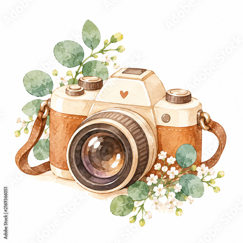 vintage photo camera with green leaves