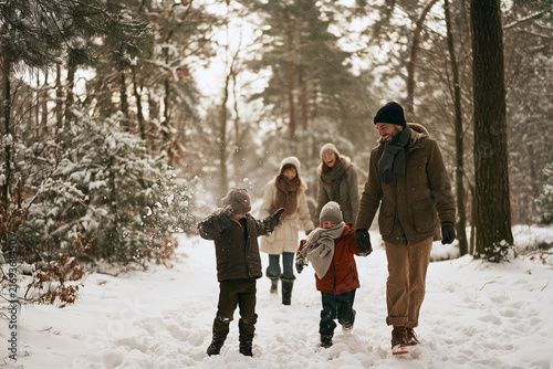 Generative AI - A family spending time together in winter forest