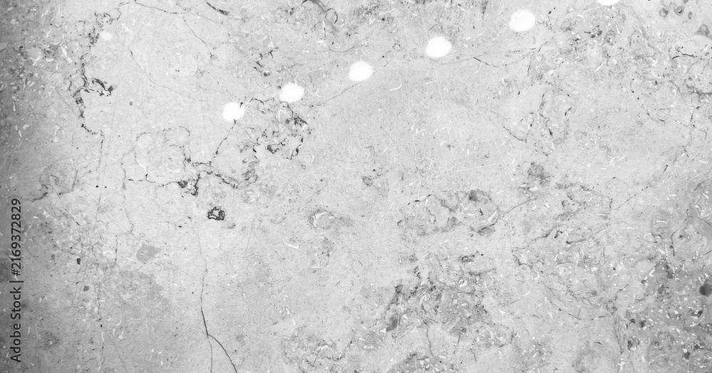 Fototapeta premium Surface with light reflections and texture in gray shades near a window