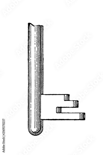 Antique key bit with notched shaft and grooves, old vintage illustration, 1897.
