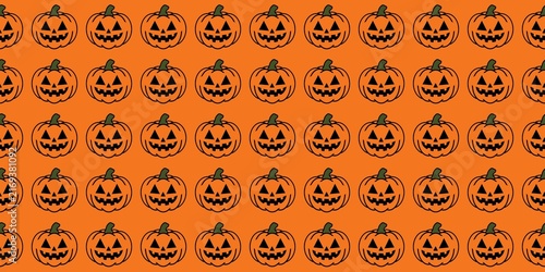 Obraz na plátně ​A festive, spooky Halloween pattern with smiling, scary jack-o'-lanterns