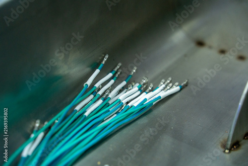 Obraz na płótnie Grouped Teal Wires with Metal Terminals on Metal Surface