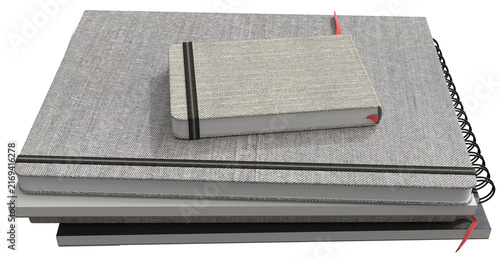Fotografie Clean minimalist stack of gray fabric-covered notebooks with elastic bands and a smaller notebook on top