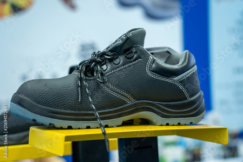 Canvastavla Black Industrial Safety Work Boot on Yellow Display Stand