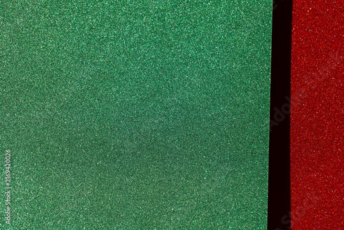  green glitter field with a red sparkling border and copy space for Christmas greetings,website headers, seasonal discounts and retail advertising.Christmas holiday sale