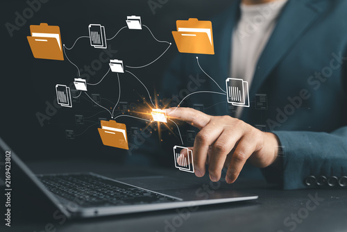 Auditor worker working with document folder ,Management of important document storage of organization ,ERP document system ,quality assessment management With a checklist ,online document database