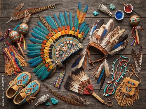 Native American style feathered headdresses and traditional handcrafted dance accessories