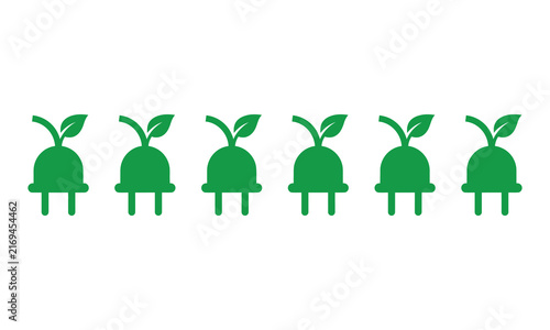 Green energy plug sprouts with leaves in a row against a clean white backdrop symbolizing sustainability and renewable power 3D rendered silhouette isolated on white background