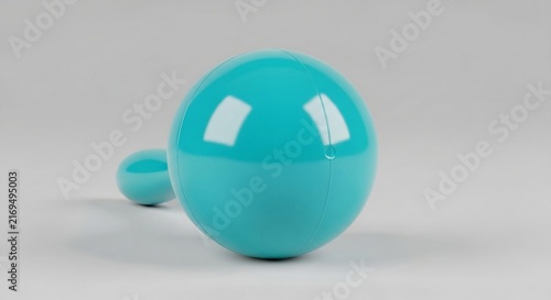 Vibrant Turquoise Plastic Maraca Isolated on a Subtle Gray Surface, Evoking Musical Celebration and Playfulness