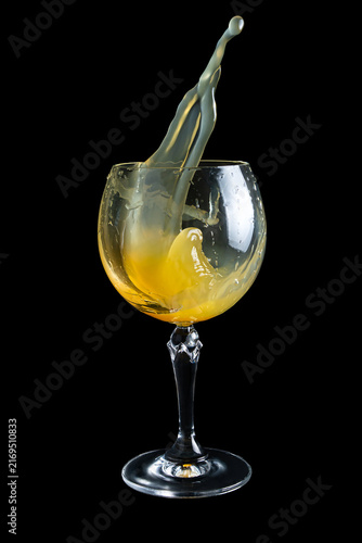 Splashing liquid in a glass during a drink pouring session at a party or gathering