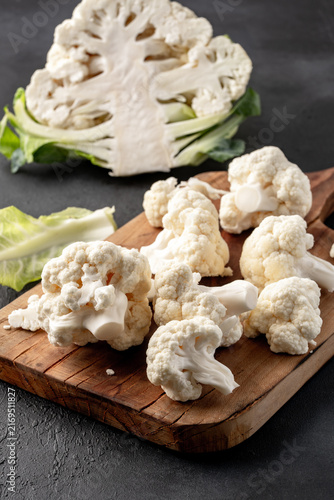 Fresh Cauliflower Isolated on Black Stone Table Background