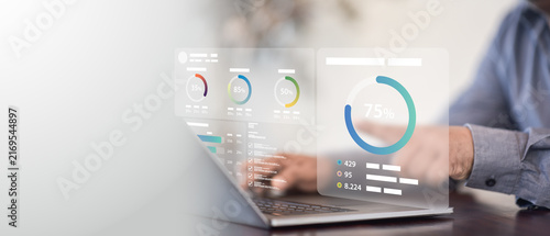 Принти на полотні Corporate analyst evaluates financial performance metrics on holographic dashboa
