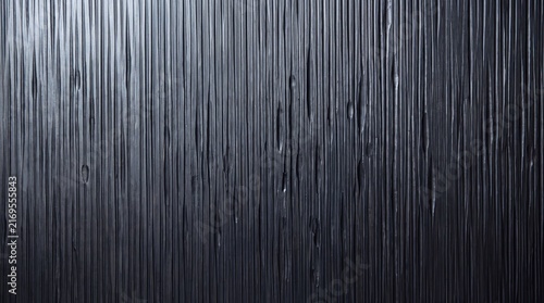 Textured Black Surface with Vertical Relief Pattern
