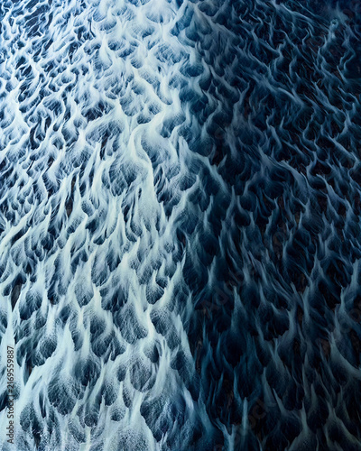 Canvas Print Detailed blue frozen surface reveals intricate crystalline ridges and organic icy patterns, creating a dramatic winter texture ideal for climate, science, backgrounds and creative design