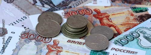Foto Russian rubles old money banknotes and coins on table